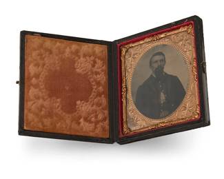 233
A Civil War era daguerreotype
A daguerreotype depicting a soldier, with a chased gold-toned metal preserver within a light orange velvet-lined tooled leather case
Sight: 2.5" H x 2.125" W
Estimate: $500 - $700