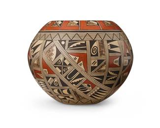 244
Rondina Huma (b. 1947, Hopi-Tewa)
A Hopi-Tewa polychrome pottery jar, late 20th century
Signed to underside: Rondina Huma / Tewa
A globular jar with fine line geometric, curvilinear and stepped motifs in multidirectional banding in red and black
4.625" H x 5.75" Dia
Estimate: $500 - $700
