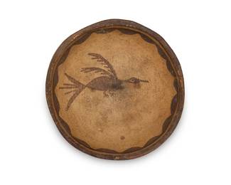 272
A small Zia Pueblo pottery dish
Mid-20th century
Unsigned, with faint pencil marks to underside: Zia / [illegible]
The three-color dish with roadrunner figure to interior and scalloped accents to rim interior
1" H x 5.125" Dia.
Estimate: $500 - $700