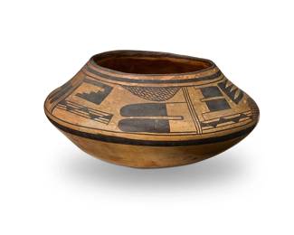 246
A Hopi Pueblo yellowware pottery bowl
Mid-20th century
Unsigned
The wide-shouldered bowl with dark brown feather and geometric banded motifs
3.75" H x 8" Dia., irregular
Estimate: $200 - $400