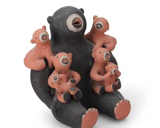 267
Louis Naranjo (1932-1997, Cochiti Pueblo)
A polychrome slip-glazed pottery Bear storyteller figure, mid/late 20th century
Signed to underside: Louis Naranjo / Cochiti, N.M.
The black slip bear with multiple bear cubs to lap and shoulders
6" H x 6" W x 5" D
Estimate: $800 - $1,200
