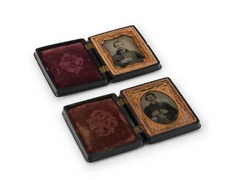 229
Two Civil War era early photographs
One daguerreotype and one tintype, both depicting a seated soldier, and with a thin chased gold-toned metal preserver, the daguerreotype within a Magenta velvet-lined thermoplastic case, the tintype within a similar case lined with dark orange velvet
Sight of each: 2" H x 1.5" W
Estimate: $300 - $500