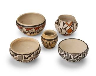 343
A group of Southwest pottery vessels
Mid-20th century
Five works:

Nellie Nampeyo (1896-1978, Hopi-Tewa)
Two polychrome pottery vessels
Comprising a three-color bowl with red and brown banded figural motifs to body, and a small jar with brown geometric motifs, each on a white slip ground
2 pieces
Bowl: 3.375" H x 6" Dia.; Jar: 3.125" H x 3.125" Dia.

Marie Z. Chino (1907-1982, Acoma Pueblo)
A pottery bowl
Signed to underside: Marie Z. Chino / Acoma. N. M.
With banded brown kiva step motifs on a white slip ground
2.75" H x 5.25" Dia.

Two Acoma Pueblo pottery vessels
Each marked to underside: Acoma. N. M.
Comprising a two-color bowl with brown kiva step motifs on a white slip, and a three-color jar olla jar with brown and orange avian motifs
2 pieces
Jar: 3.5" H x 4.75" Dia.; Bowl: 3" H x 5.375" Dia.

5 pieces total
Estimate: $500 - $700