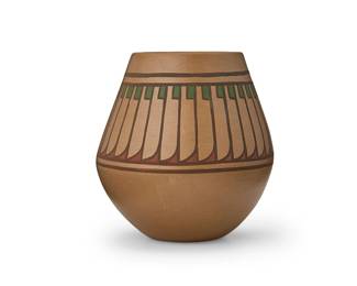 12
Crucita "Blue Corn" Calabaza (1921-1999, San Ildefonso Pueblo)
A polychrome pottery jar, mid-20th century
Incised to underside: Blue Corn / San Ildefonso Pueblo
The four-colored jar with banded eagle feather motifs in green, red, and brown on a cream slip ground
5.875" H x 5.625" Dia.
Estimate: $700 - $900