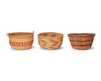 207
A group of Native American baskets
Early 20th century
Three twined baskets comprising a polychrome Klamath basket with zigzag banding (3.625" H x 6.5" Dia.), a polychrome Pit River berry basket with striped banding (4" H x 7" Dia.), and a Northwest Coast basket with stepped key motif and two handles to rim (4.25" H with handles x 7" Dia.)
3 pieces
Estimate: $400 - $600