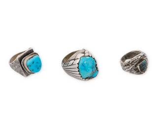 329
Three Southwest sterling silver and turquoise rings
Mid/late 20th century
Each unmarked
Comprising three chunky silver rings, each with textured bands and with set turquoise of various colors and sizes
3 pieces
Ring sizes: 11.5; 11.75; 8.5
94.9 grams gross
Estimate: $200 - $400