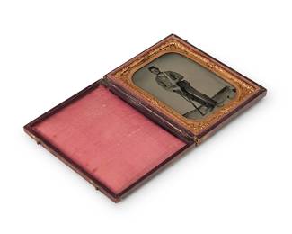 214
A Civil War era tintype
A tintype depicting a soldier with his rifle and bayonet, with a chased gold-toned metal preserver within a red velvet-lined tooled leather case
Sight: 3.5" H x 2.5" W
Estimate: $400 - $600