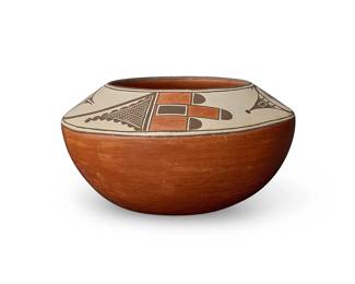 273
Vincentita Pino (1917-2009, Zia Pueblo)
A polychrome pottery jar, late 20th century
Signed and inscribed faintly to side: Vincentita Pino / Zia Pueblo
The three-color low jar with red and brown avian and kiva motifs to shoulder on a white slip ground, above a terra cotta wash
5.25" H x 10" Dia.
Estimate: $600 - $800