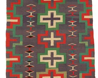 62
A Navajo Germantown child's blanket
Late 19th century, Diné
Woven in red, green, black, cream and blue wool, with a central column of concentric crosses, flanked by floating conjoined diamonds and half crosses to each side, with red band to each end
34.5" H x 47.5" W
Estimate: $2,000 - $3,000