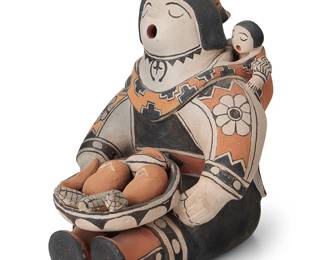 270
Louis Naranjo (1932-1997, Cochiti Pueblo)
A polychrome slip-glazed pottery storyteller, mid/late 20th century
Signed to underside: Louis Naranjo / Cochiti, N. M.
The seated figure holding bowl of corn and bread, with child wrapped to her back
8.75" H x 7.75" W x 8" D
Estimate: $800 - $1,200