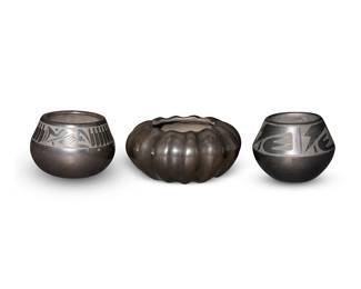 23
A group of Southwest Pueblo blackware pottery
Three works:

Anita L. Suazo (b. 1937, Santa Clara Pueblo)
A blackware melon bowl, late 20th century
Signed to base: Anita L. Suazo / Santa Clara Pueblo / [artist's cipher]
The low wide bowl with rounded ridges
3" H x 6.25" Dia.

Cavan Gonzales Tse-whang "Eagle Tail" (b.1970, San Ildefonso Pueblo)
A blackware jar with pictorial band, late 20th/21st century
Signed to base: Cavan Gonzales / "Eagle Tail"
The tapered jar with a band of slip-painted motifs including feathers, with scattered diminutive motifs to bodym and an inset coral bead
3.25" H x 4.5" Dia.

Lupita Martinez (1919-2006), San Ildefonso Pueblo)
A blackware jar with geometric band, mid/late 20th century
Signed (faintly) to base: Lupita Martinez
The tapered jar with slip-painted motifs to shoulder
3.25" H x 4.375" Dia.

3 pieces
Estimate: $400 - $600