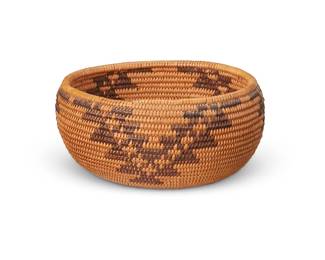 168
A small Washoe basket
Early 20th century; Northern California/Nevada
The coiled low bowl with three stepped "V" geometric motifs
2.25" H x 4.5" Dia.
Estimate: $200 - $400