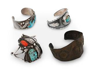 323
A group of Southwest-style sterling silver and mixed metal bracelets
Late 19th to mid-20th century
Each unmarked
Comprising tapered silver cuff with silver overlay and shadowbox-set central turquoise cabochon, a silver band cuff with large oblong set turquoise and silver feather overlay, and a three wire cuff with set coral and turquoise with silver overlay and ball accents, as well as a tapered copper cuff with central repoussé mask and circular motifs
4 pieces
Largest: 7" total inner C x 1.5" Dia., with a 1.25" gap; Smallest: 6" total inner C x 2.5" H, with a 1.5" gap; copper: 8" total inner C x 1.75" H, with a 1.375" gap
199.2 grams gross
Estimate: $700 - $900