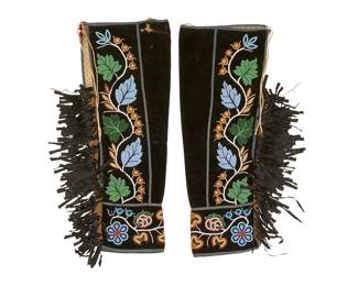 292
A pair of Ojibwe/Chippewa beaded velvet leggings
Late 19th/early 20th century, Anishinaabe; Great Lakes/Northern Plains
A pair of tapered hand-sewn black velveteen beaded leggings with traditional multicolored twining floriform beadwork to sides and to cuffs, each outer edge with attached band of black silk ribbon fringing, and with blue wool binding to edges and seams; each legging lined with cream dotted cotton, and secured with cotton twill tape ties
28" - 27.5" H x 21.5" - 21" W (open top edge)
Estimate: $500 - $700