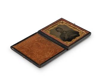 224
A Civil War era tintype
A tintype depicting a soldier holding his revolver, with a chased gold-toned metal preserver with a burnt orange velvet-lined tooled leather case
Sight: 2.5" H x 2" W
Estimate: $300 - $500