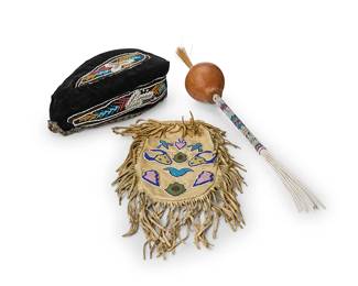 294
A group of Native American beaded items
Three works:

A Plains beaded hide drawstring pouch bag
Late 19th/early 20th century; Northern Plains
With multicolored beadwork buffalo and floriform motifs to each side, with fringed edges
15.25" H x 5.25" W

A Haudenosaunee Iroquois beaded Glengarry cap
Late 19th/early 20th century; Northeastern United States/Canada
With multicolored floral beadwork motifs on dark brown/black velvet with multicolored passementerie trim, red ribbon trim, and later fabric lining
4" H x 5.5" W x 10" D

A Northern Plains/Winnebago gourd "peyote" rattle
Mid-20th century; Northern Plains/Nebraska
With polychrome beaded handle, twisted cord fringe, and horsehair tufted topper
21.5" H x 3" Dia.

3 pieces
Estimate: $700 - $900