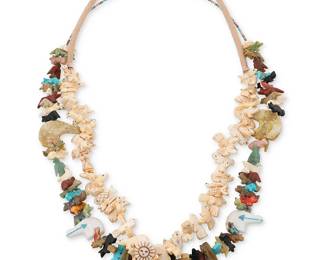 325
Two Southwest Zuni-style carved stone fetish necklaces
Late 20th century
Featuring two single strand necklaces of stacked carved animal fetish figures, including heartline bears, wolves, foxes, turtles, eagles, armadillos, fish, and katsinas, one with a large central carved jet standing bear and stacked animals in various stones such as turquoise, mother of pearl, spiny oyster, and pipestone, with fine shell heishi (32" L) and one with carved bone fetish figures with a central Sunface dancer figure and a traditional wrapped neck cord (30" L)
2 pieces
239.3 grams gross
Estimate: $300 - $500
