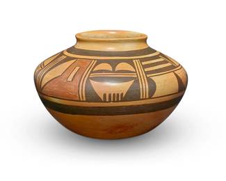 122
Fannie Nampeyo (1900-1987, Hopi-Tewa)
A polychrome yellowware olla, mid/late 20th century
Signed to underside: Fannie Nampeyo
The three-color jar with banded brown and red geometric motifs to shoulder
3.625" H x 5.5" Dia.
Estimate: $400 - $600