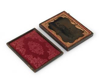 221
A Civil War era tintype
A tintype featuring a portrait of a soldier posed beside a column, with a chased gold-toned metal preserver within a red velvet-lined tooled leather case
Sight: 3.5" H x 2.625" W
Estimate: $250 - $350
