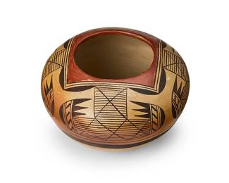 123
Fannie Nampeyo (1900-1987, Hopi-Tewa)
A polychrome yellowware pottery jar, mid-20th century
Signed to underside with artist's corn cipher: Fannie Nampeyo
The three-color jar with the Nampeyo family's signature migration motif
4" H x 6.25" Dia.
Estimate: $400 - $600
