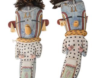 196
Clark Tenakhongva
(b. 1957, Hopi-Third Mesa-Hoat'Ve'La)
Two Hopi Pueblo Third Mesa Snipe katsinas
Polychrome painted cottonwood, feathers, corn husk
Each with feathers to top, corn husk earrings, and bird motif to forehead, signed to underside: C.W.T. / !!
2 pieces
Larger: 16.5" H x 4.5" W x 4.25" D; Smaller: 15" H x 5.75" W x 5" D
Estimate: $200 - $400