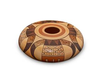 242
Dee Johnson Setalla (b. 1963, Hopi-Tewa)
A polychrome pottery jar, early 21st century
Initialed and with the artist's bear paw cipher to underside: D S / Hopi
The three-color low jar decorated in orange and brown with four large corn and feather motifs on a cream slip ground
4.25" H x 9.75" Dia.
Estimate: $400 - $600