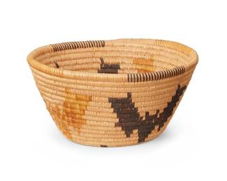 165
A polychrome Panamint pictorial basket
Mid-20th century, Timbisha Shoshone; Eastern Central California
The small coiled flared bowl with a band of alternating bat motifs, a star to the base, and rim ticking
3.125" H x 6.25" Dia.
Estimate: $600 - $800
