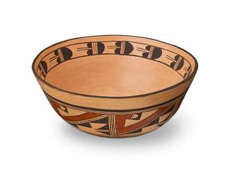 188
Garnet Pavatea (1915-1981, Hopi-Tewa)
A polychrome pottery bowl, late 20th century
Signed to underside: Garnet Pavatea
The three-color bowl with red and brown kiva step motif to exterior and brown banded feathers to interior under rim, on a cream slip
4.625" H x 11.125" Dia.
Estimate: $500 - $700