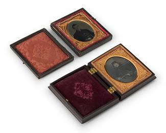 237
Two Civil War era early photographs
A daguerreotype depicting a seated soldier, with a chased gold-toned metal preserver within a light red velvet-lined tooled leather case, and the other a tintype depicting a seated Union soldier with a chased gold-toned metal preserver within a magenta velvet-lined thermoplastic case
Sight of each: 2" H x 1.5" W
Estimate: $400 - $600
