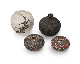344
A group of miniature Southwest pottery vessels
Late 20th/early 21st century
Four works:

Miriam Gallegos (b. 20th century)
Two Mata Ortiz seed pots
Each with incised signature to underside: Miriham Gallegos
The three-color pots, each with black and red intricate geometric motifs on a white slip ground
2 pieces
Larger: 1.5" H x 2" Dia.; Smaller: 1.125" H x 2" Dia.

Fito Tena (b. 20th century)
A Mata Ortiz blackware bud vase
With corrugated body
2.375" H x 2.625" Dia.

A polychrome seed pot
Signed to underside with eagle feather cipher and possibly reading: Dawao
The pot with swirling protrusions to one side, depicting a corn stalk in brown on a white slip ground
2.375" H x 2.375" Dia.

4 pieces total
Estimate: $200 - $300