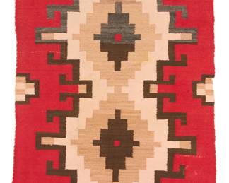 71
A Navajo regional rug
Mid-20th century, Diné
Woven in red, dark grey, pale pink, variegated light brown, and dark brown, with two conjoined stepped hooked diamonds to center, with hooked motifs and crosses to sides, and banded ends
70" H x 34" W
Estimate: $400 - $600
