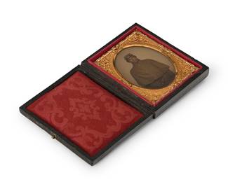 232
A Civil War era daguerreotype
A daguerreotype depicting a uniformed soldier standing, with a chased gold-toned metal preserver within a red velvet-lined tooled leather case
Sight: 2" H x 1.5" W
Estimate: $250 - $350