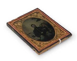 225
A Civil War era tintype
A tintype depicting a seated soldier with his cap under his arm, with a chased gold-toned metal preserver within a tooled leather case
Sight: 3.5" H x 2.5" W
Estimate: $200 - $300