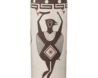 40
Charmae Shields Natseway (b. 1958, Acoma Pueblo)
A polychrome pottery sculptural vase, early 21st century
Signed and inscribed to underside with artist's corn cipher: Charmae Shields Natseway / Acoma, N. M.
The cylindrical vase with small stopper/lid, decorated in brown and red Mimbres-style zoomorphic and anthropomorphic figures on a white slip ground
With stopper: 11.875" H x 4.125" Dia.
Estimate: $400 - $600