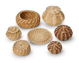 210
A group of Native American pine needle baskets
Late 20th/21st century; Louisiana & Southwest United States
Seven coiled basketry items including two Coushatta lidded baskets, one by Madeline Celestine (3" H x 4" Dia.) and one by Diana Schuff (2.25" H x 3" Dia.), together with two Tohono O'odham Papago baskets including a coiled tray (5.75" Dia.) and a larger lidded basket (5" H x 5.5" Dia.) as well as two additional lidded baskets (3" H & 2.5" H x 3.5" Dia.) and a low bowl (2.75" H x 6.25" Dia.)
7 pieces
Estimate: $100 - $200