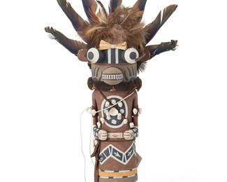 198
Tayron Polequaptewa
(b. 1969, Hopi Sun Clan)
A Hopi Pueblo Honiwa Brown Bear katsina
Polychrome painted cottonwood, feathers, shearling, suede, shells, corn husk
With miniature shell and leather cord lacing, large feather headdress and bear paw claw motifs, signed to underside: Tay Polequaptewa / [artist's cipher]
14" H x 8" W x 4.5" D
Estimate: $300 - $500