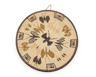 211
A polychrome Wounaan butterfly basketry tray
Late 20th/21st century; Darien Rain Forest, Panama, Central America
A small coiled flat tray with scattered butterfly motifs and geometric motifs to rim
0.5" H x 10.5" Dia.
Estimate: $100 - $200
