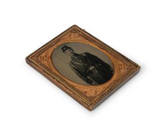 216
A Civil War era tintype
A tintype depicting a soldier in full uniform with his rifle, with a chased gold-toned metal preserver within a tooled leather case
Sight: 3.5" H x 2.625" W
Estimate: $300 - $500