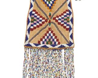 287
A Native American beaded hide tobacco bag
Mid/late 20th century
The hide bag with drawstring opening, featuring polychrome beadwork depicting an elaborate X form centering stepped motifs above strands of bead fringe
Without fringe: 9" H x 6.5" W
Estimate: $400 - $600