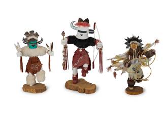 260
A group of large Southwest katsina figures
Late 20th century
Three works:

Evelynnita Willie (b. 20th century)
A "Zuni Rain Priest" dancer figure with bow and arrow
Signed and titled to underside: Evelynnita Willie
In polychrome painted wood, with feather, fur, shell, and leather accents
22" H x 12.25" W x 11" D

Jacida Loley (b. 20th century, Navajo/Diné)
A "Medicine Man" dancer with feather fans
Signed, titled, and numbered to underside: Jacida L / 637934
In polychrome painted wood with feather, fur, and leather accents
18.5" H x 11.5" W x 8" D

F. Willie (b. 20th century, Navajo/Diné)
A "Hoop Dancer" katsina-style figure with elaborate feathers
Signed, titled, and numbered to underside: F. Willie / 401932 / [cipher]
In polychrome painted wood with feather, turquoise, fur, horsehair, and leather accents
18.5" H x 17" W x 13" D

3 pieces
Estimate: $300 - $500