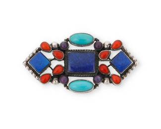 331
A Leo Feeney Southwest-style stone-set brooch
Late 20th/21st century
Stamped verso for maker and for sterling
The small sterling silver geometric brooch with set turquoise, coral, sugilite, and lapis lazuli
1.25" H x 2.25" W
14.1 grams gross
Estimate: $150 - $250
