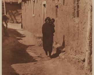 240
After Edward S. Curtis
(1868-1952)
"Zuni Street Scene," plate 605 from "The North American Indian," 1925
Photogravure in brown on paper
From the Suffolk Engraving Co., Cambridge, MA edition printed after the 1925 original photograph copyrighted by Curtis; with the title, plate number, copyright, publisher, and artist name all printed in the blank outside the image
Image: 15.5" H x 11.5" W; Sight: 16.75" H x 12.5" W
Estimate: $300 - $500