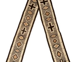 66
A Navajo regional runner
Mid-20th century, Diné
An extra-long narrow rug woven in grey, cream, black, and light brown wool with multiple alternating serrated and stepped diamonds and cross motifs
230" H x 20.5" W
Estimate: $1,000 - $1,500