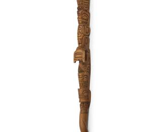 302
David Nahanee
(1937-2022, Squamish/Coast Salish)
A carved Totem talking stick, late 20th/21st century
Wood, likely cedar
A carved wood "speaker's staff" with multiple animal and figural totem figures, including Thunderbird, Bear, Killer Whale, Serpent, and Frog, with incised signature and attributes verso: D. Nahanee
35.5" H x 2.75" W x 2.125" D
Estimate: $300 - $500