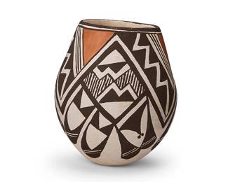 279
Lucy M. Lewis (1898-1992, Acoma Pueblo)
A polychrome jar, mid-20th century
Signed to underside: Lucy M. Lewis. Acoma.
The three-color jar with brown and orange geometric motifs on a white slip ground
4.625" H x 4" Dia.
Estimate: $300 - $500