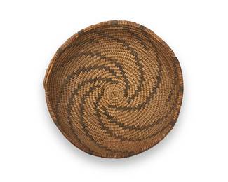 169
A Mono/Paiute basket
Early/mid-20th century; Central California/Great Basin
The coiled low bowl with a central radiating spiral whorl motif
2.75" H x 9.75" Dia.
Estimate: $200 - $300