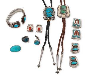 333
A group of Southwest jewelry and dress accessories
Mid/late 20th century
Variously marked for maker and/or for sterling
Nine works comprising two sterling silver bolos, one with set turquoise, and one with set chrysoprase (each with etched marks: CCE); together with three sets of interchangeable watch band terminals in silver and set turquoise, coral and turquoise chip mosaic, and silver overlay (one with band, marked: JWC), as well as a pair of cuff links with set coral, and three further single cuff links with set turquoise
12 pieces
Bolos: 2" & 1.625" H; cords: 39 & 38" L; Terminals: 1.25" to 1" H x 1.5" W; Cuff links: 1.25" to 0.75" H
232.1 grams gross
Estimate: $400 - $600