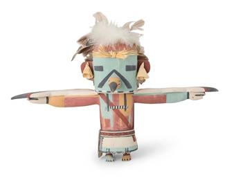 194
Clark Tenakhongva
(b. 1957, Hopi-Third Mesa-Hoat'Ve'La)
A large Hopi Pueblo Third Mesa Eagle katsina
Polychrome painted cottonwood, feathers, corn husk
With outstretched wings, applied feathers, and corn husk earrings, signed to underside: C.W.T. / !!
15.5" H x 20.25" W x 7" D
Estimate: $300 - $500