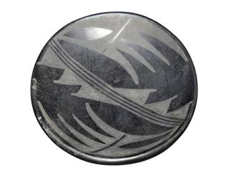 6
Maria & Santana Martinez (1887-1980 & 1909-2002, San Ildefonso Pueblo)
A small blackware dish, mid-20th century
Incised to underside: Marie + Santana
The tray with black on black geometric motifs
1" H x 6.125" Dia.
Estimate: $300 - $500