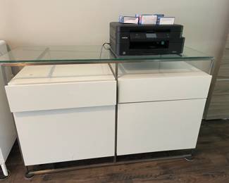 White lacquer cabinets with glass top, approx 4’ by 17”